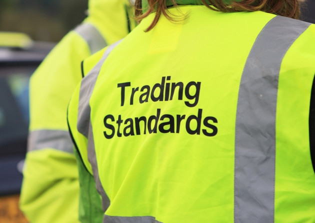 two people wearing high-vis Trading Standards tabbards